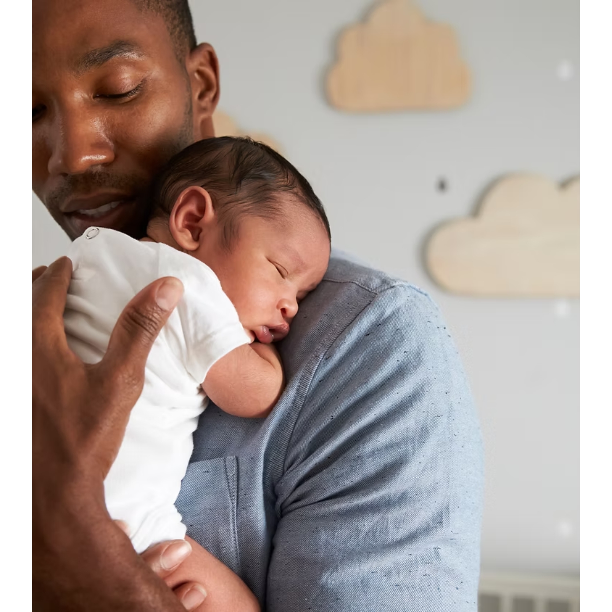 A tender moment between a parent and their baby at home
