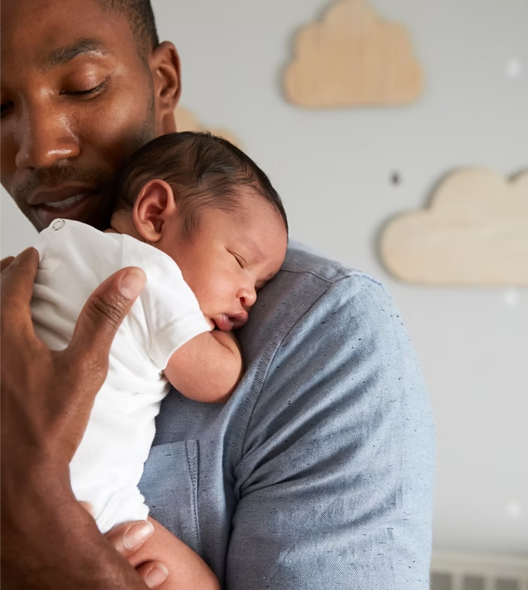 A tender moment between a parent and their baby at home